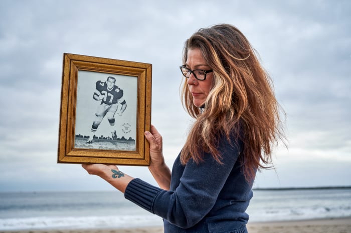 Linda Lee Stonebreaker holding a portrait of her father